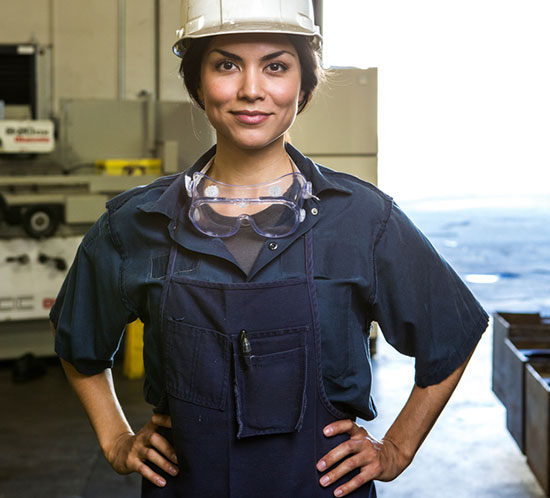 Young female worker in a machine shop